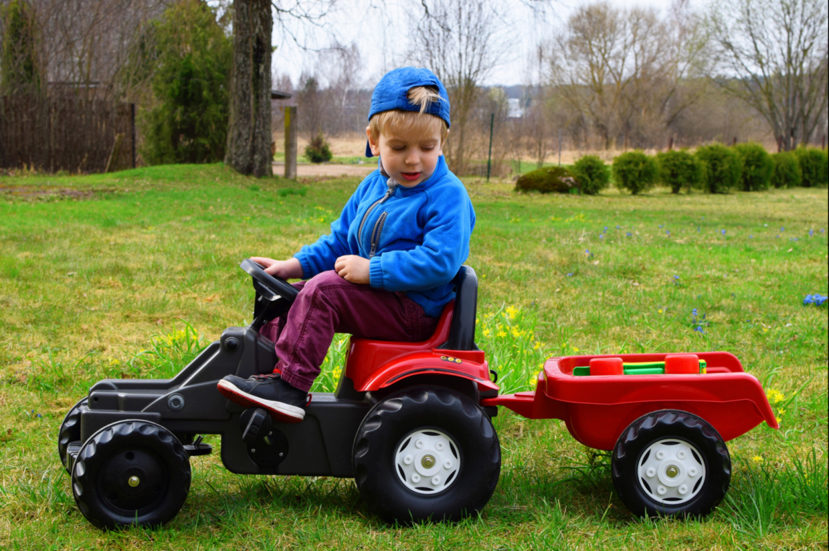 Little Boy Taking His Farm Animals for Ride on Tractor Is Melting